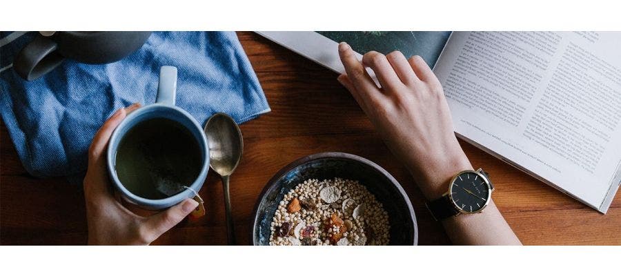 Eco-conscious person eating oatmeal and drinking tea