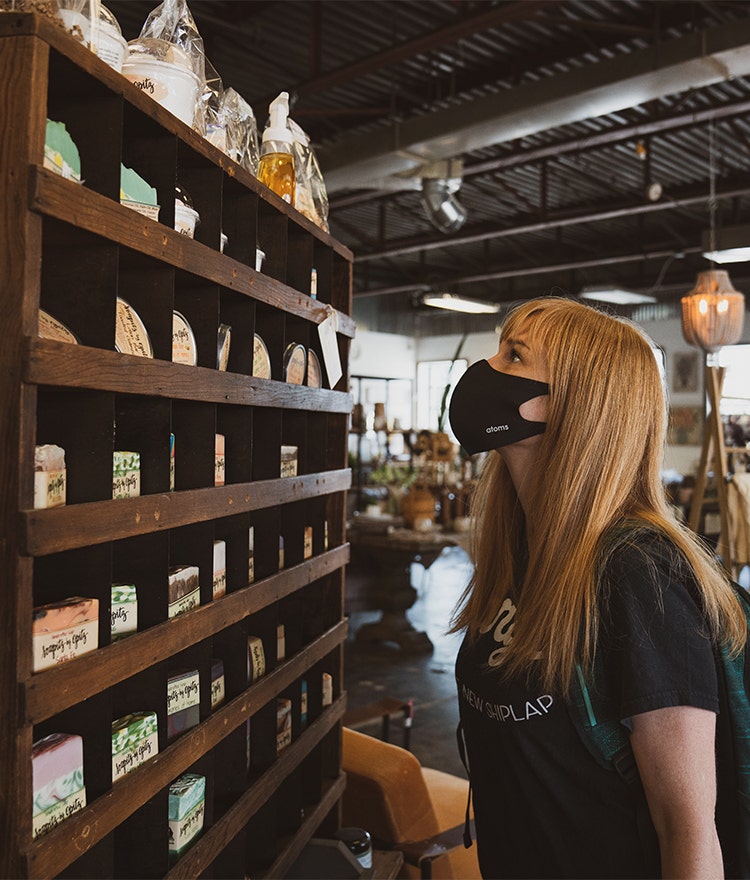 Woman shopping at a local soap and cosmetics store