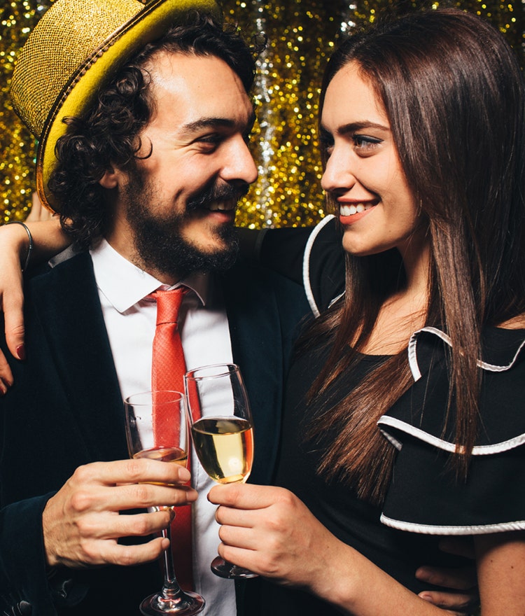 Couple getting ready for a champaign toast at midnight