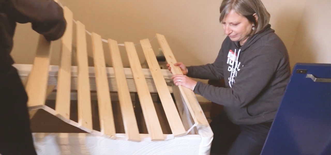 Humble Design volunteers assembling a wooden bed foundation