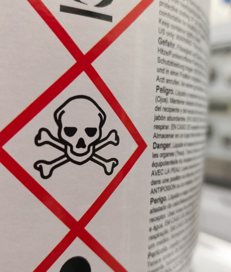 Skull and crossbones warning label on a product tag