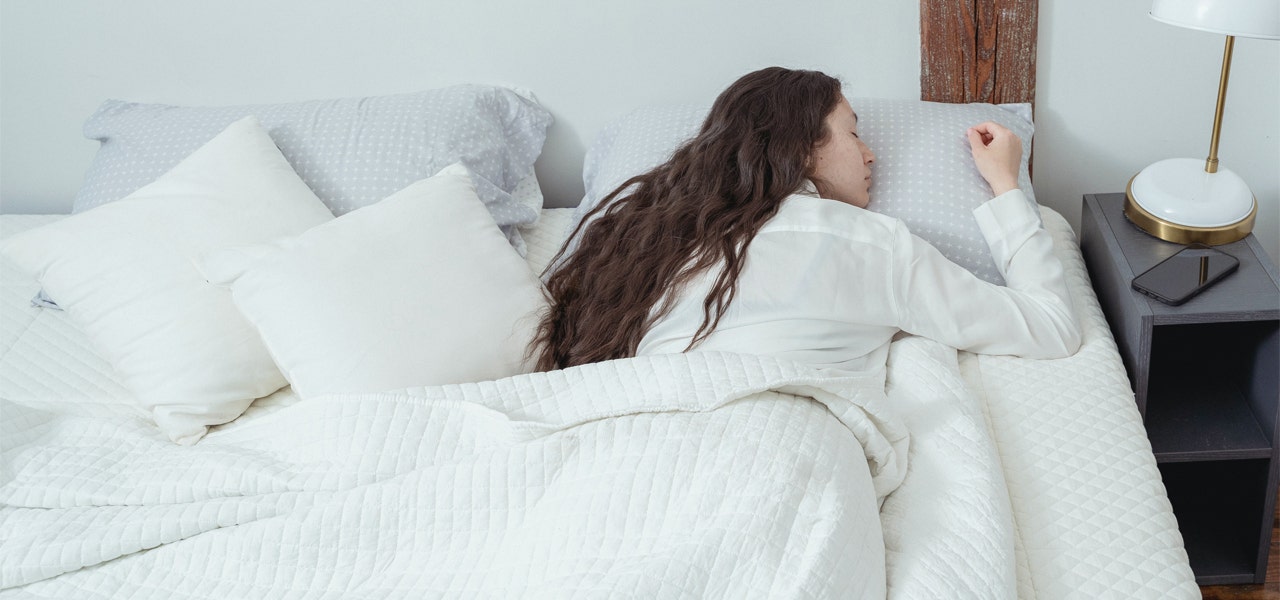 Woman sleeping soundly in her bed