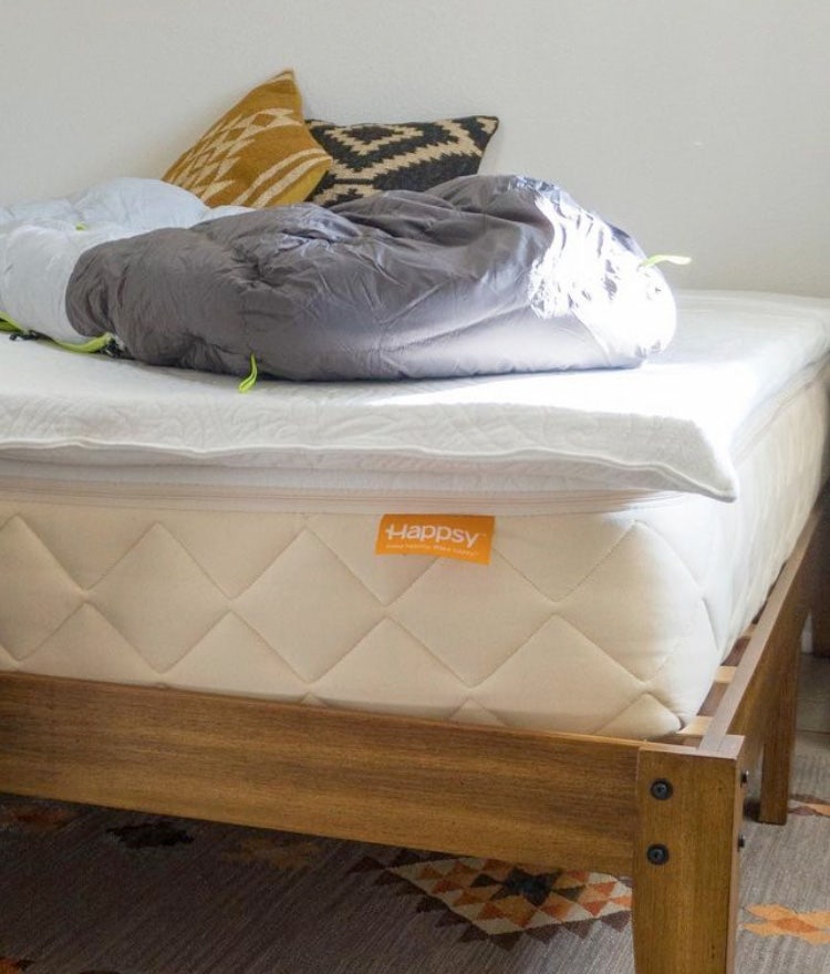 Happsy 100% organic mattress on a wooden bed frame