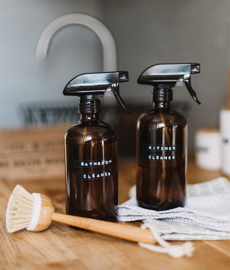 DIY cleaning products on a wooden countertop