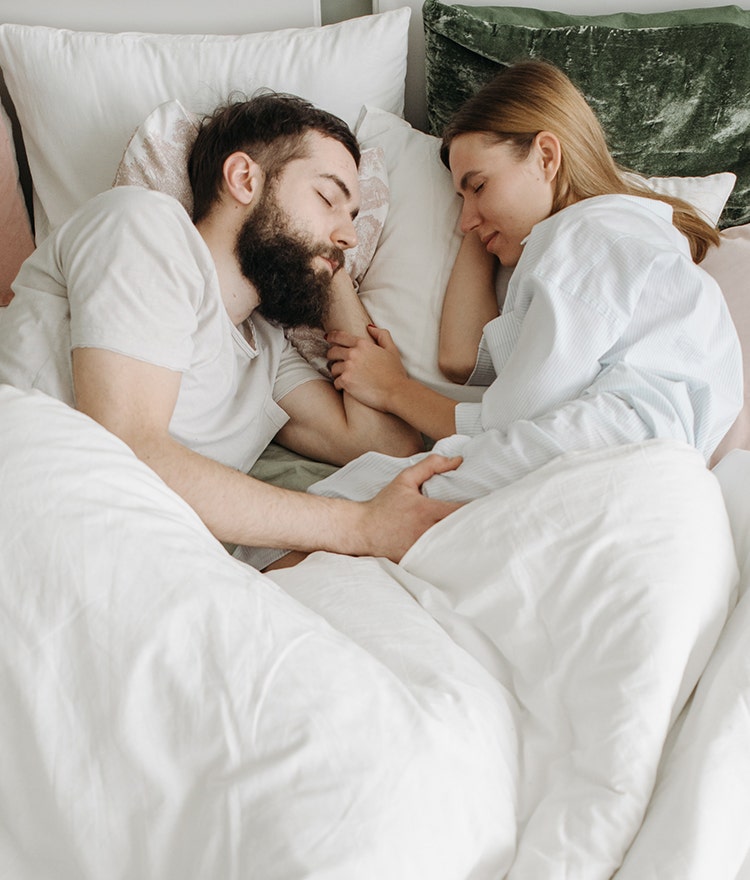 Couple sleeping peacefully together without disturbing one another