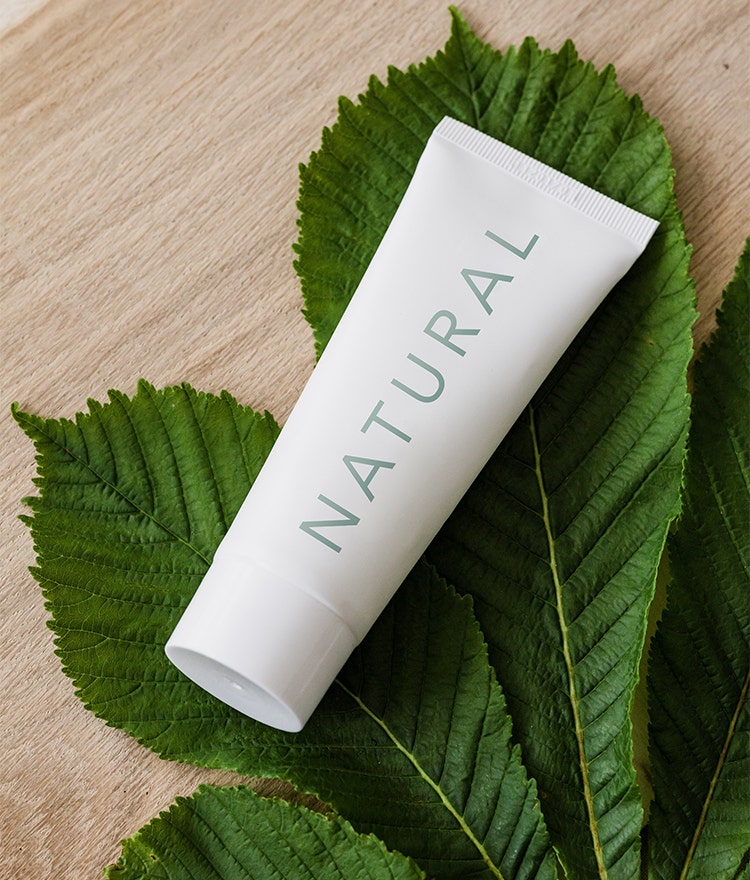 Hand cream tube with the word "natural" on the packaging