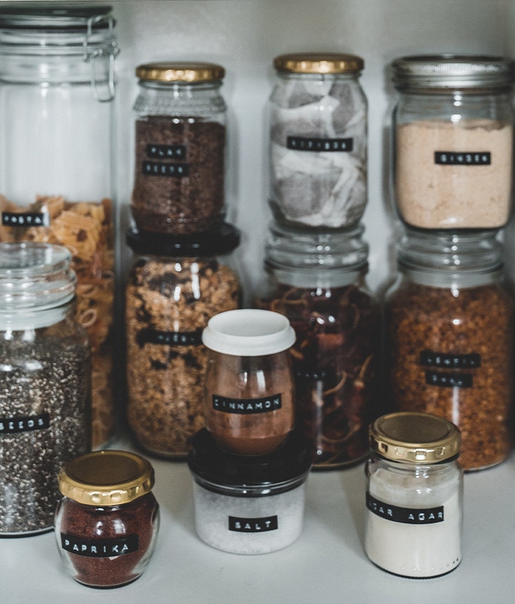 Glass jars that have been repurposed as spice containers