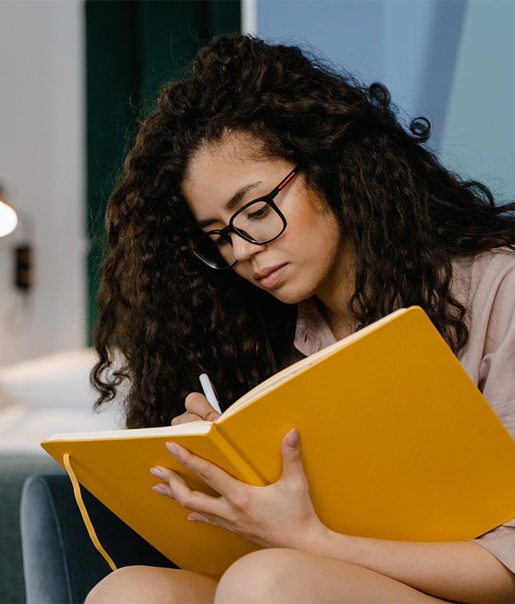 Woman journaling as a emotional self-care