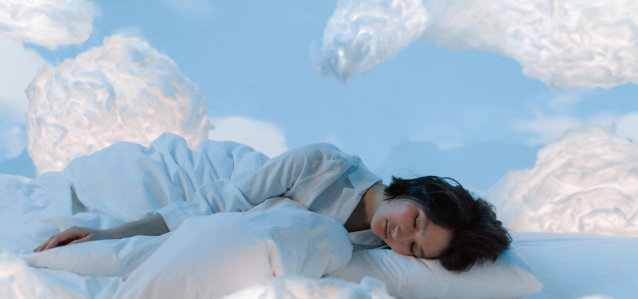 person sleeping in the clouds